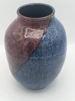 Ceramic vase with a two-tone design on a white background