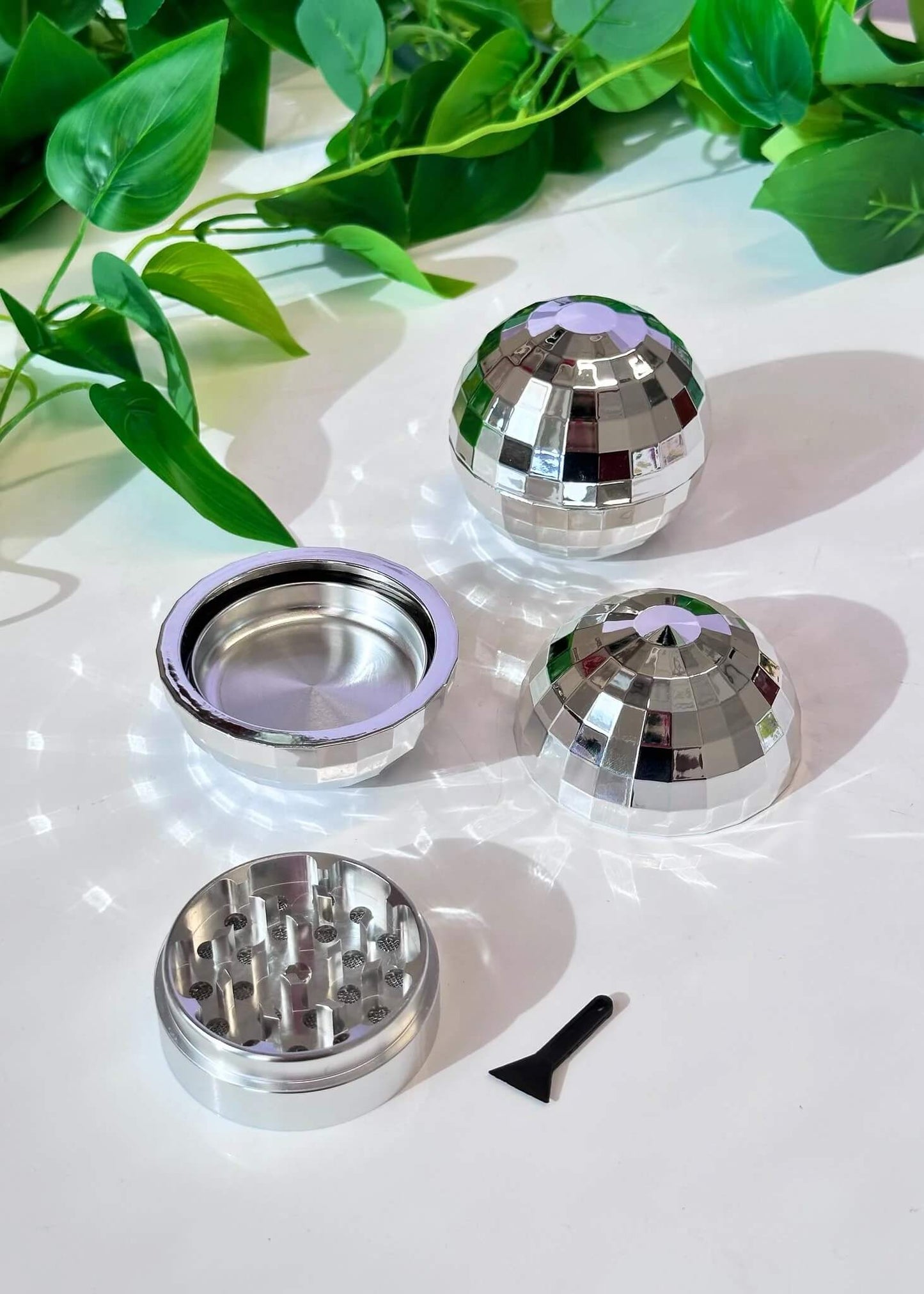 Disco ball herb grinder
3-piece magnetic grinder
Retro silver grinder
Aluminum teeth herb grinder
Canna Style disco grinder
Plastic disco ball exterior
Novelty herb grinder gift
Retro-themed grinder
2.5 inch disco herb grinder
Unique party grinder