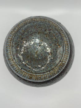 Detailed green pottery jar
Functional clay art