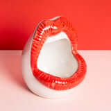 Lips shaped ashtray
Ceramic lips trinket tray
Red or pink lips dish
Fun coffee table ashtray
Food-safe ceramic dish
Bold lips home decor
Feminine novelty ashtray
Cute jewelry or key tray
5 inch ceramic lips tray
Eye-catching ashtray design