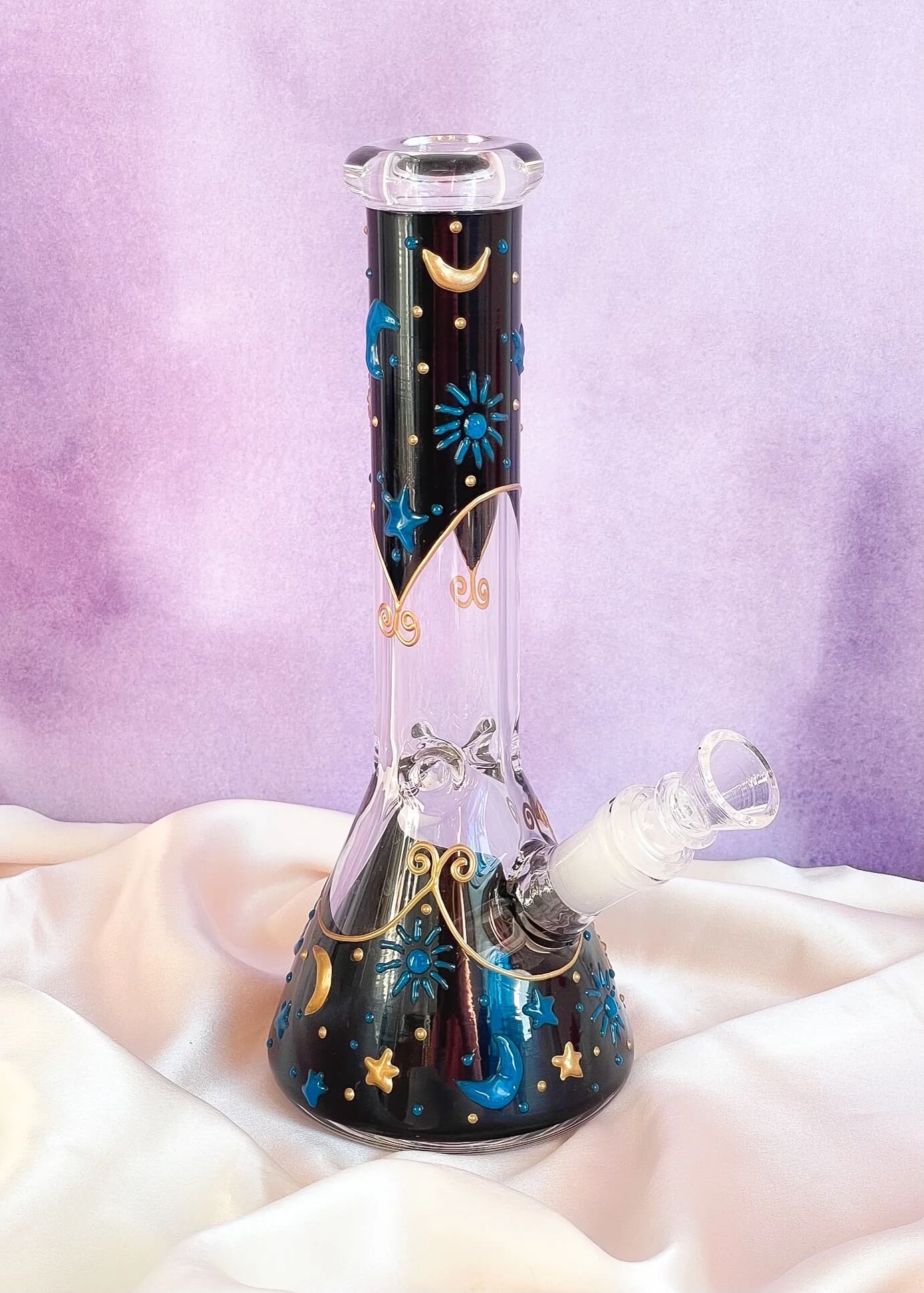 Midnight celestial bong
Glow in the dark bong
Star and moon glass bong
10 inch ice catcher bong
Glow glass water pipe
Celestial-themed bong
Blue moon star bong
Borosilicate glow bong
14mm bowl celestial pipe
Glow night sky bong