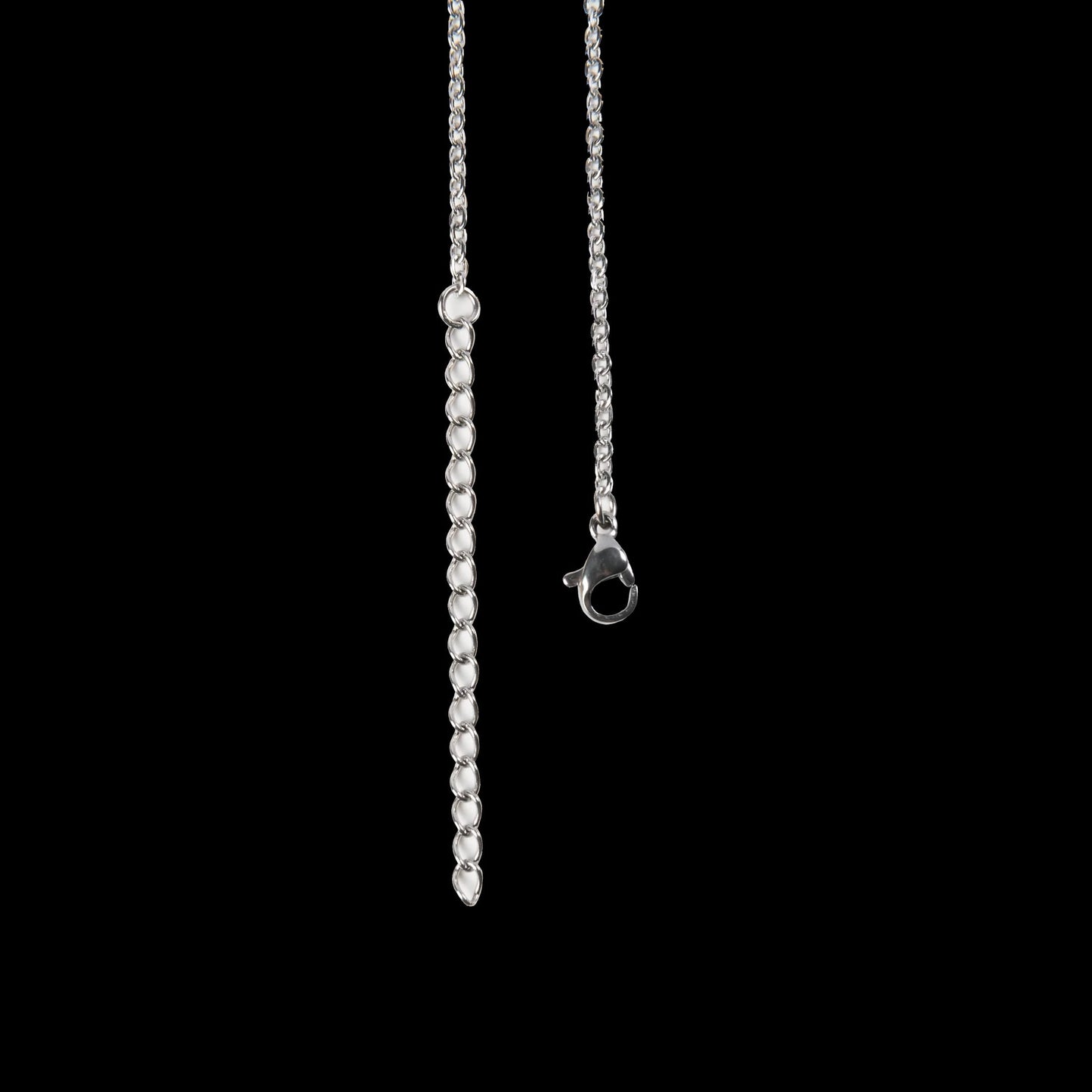 Silver necklace with a beaded chain on a black background