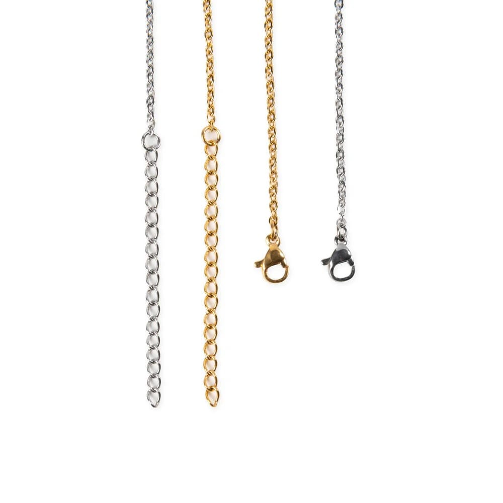 Three necklace chains in silver, gold, and black on a white background