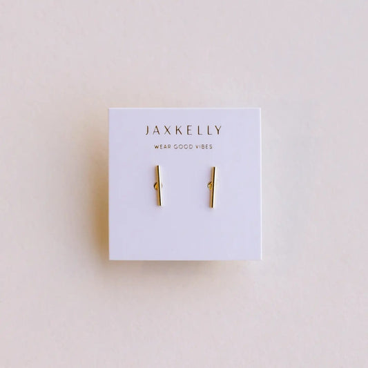 Gold bar earrings on a Jaxkelly branded card against a beige background
