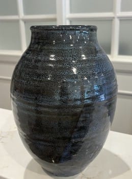 Mike Teal pottery, porcelain vase, blue black oil spot glaze, handmade ceramics, functional art, wheel-thrown pottery, Tulsa ceramic artist, contemporary vase, artisan decor, YENology artisan collection