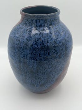 Blue ceramic vase on a white background