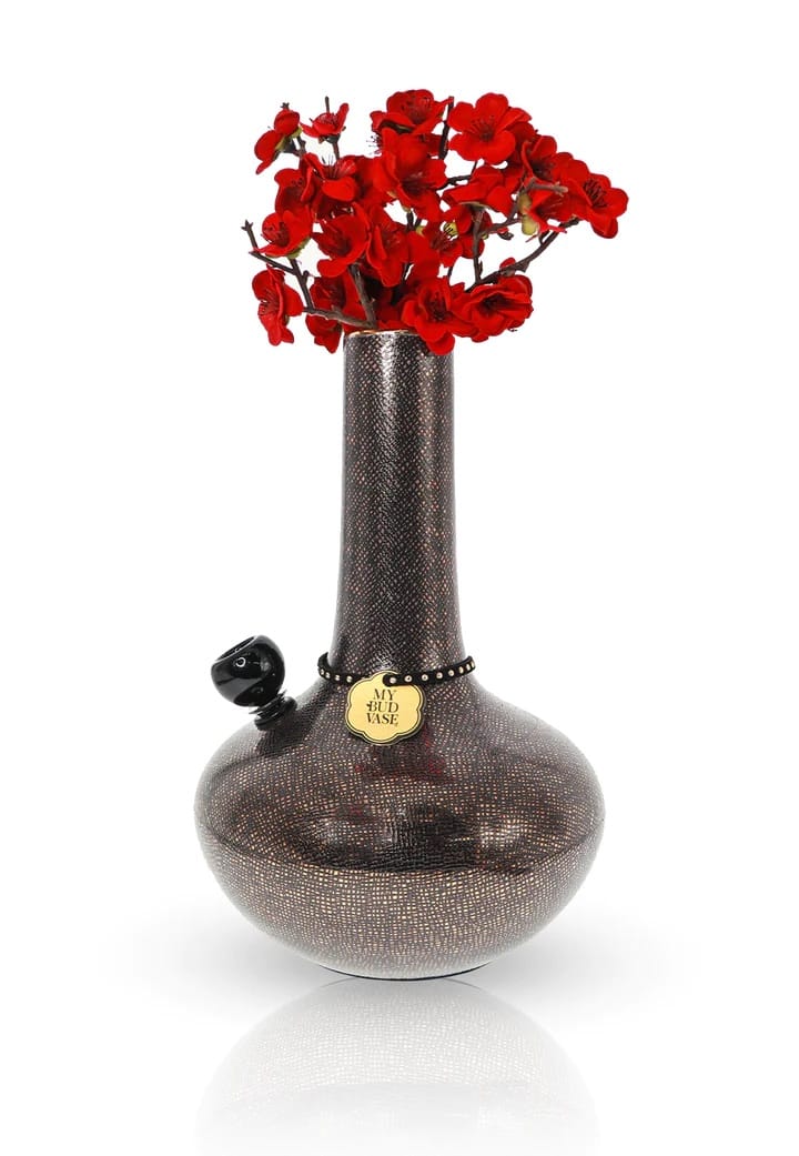 Decorative vase with red flowers on a white background