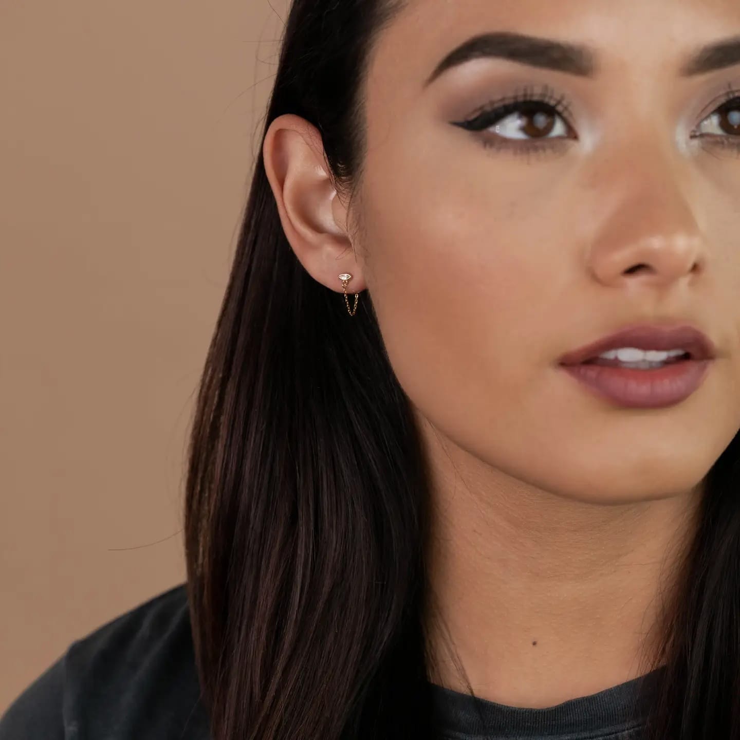 Close-up of a woman's face with a neutral background