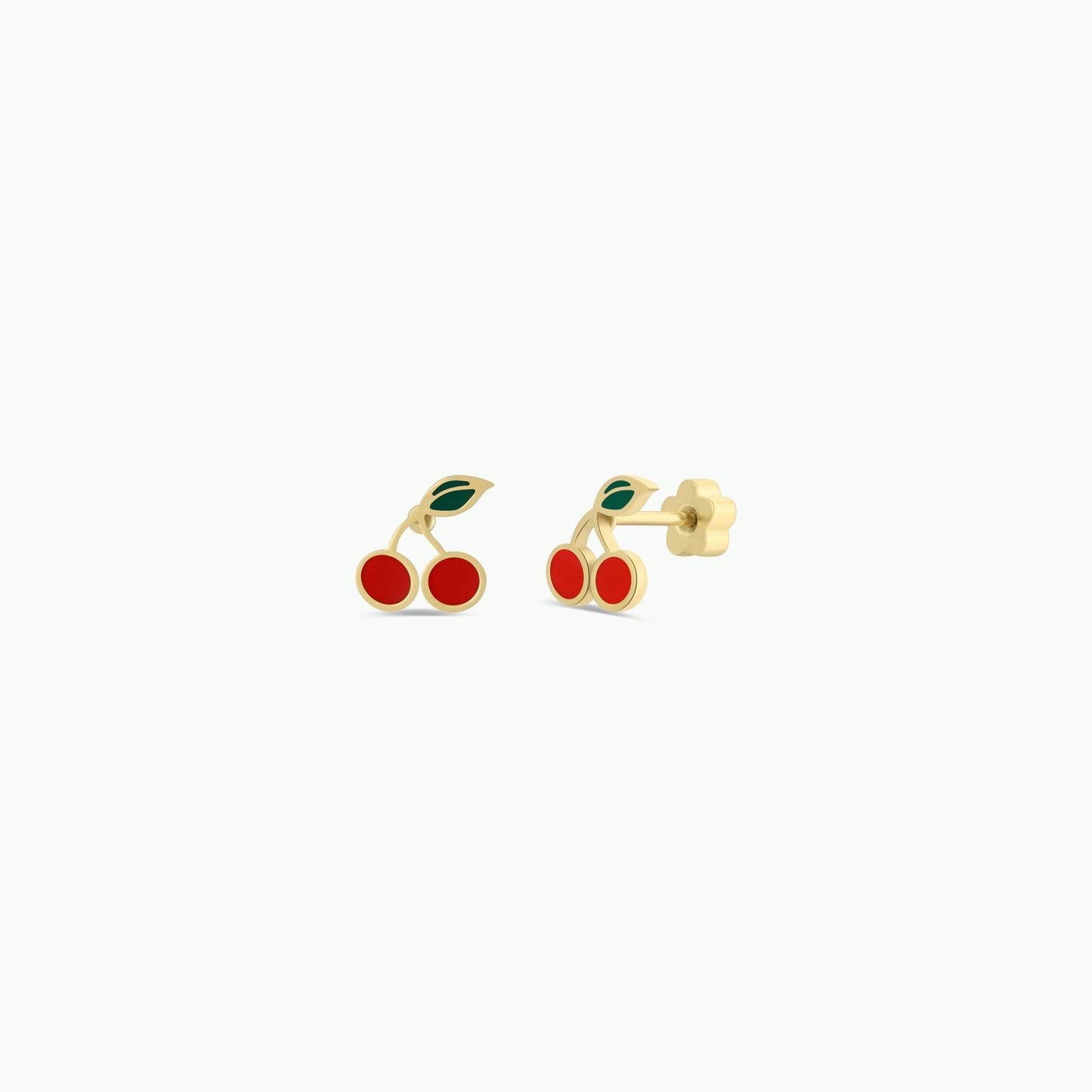 Cherry-themed gold earrings on a white background