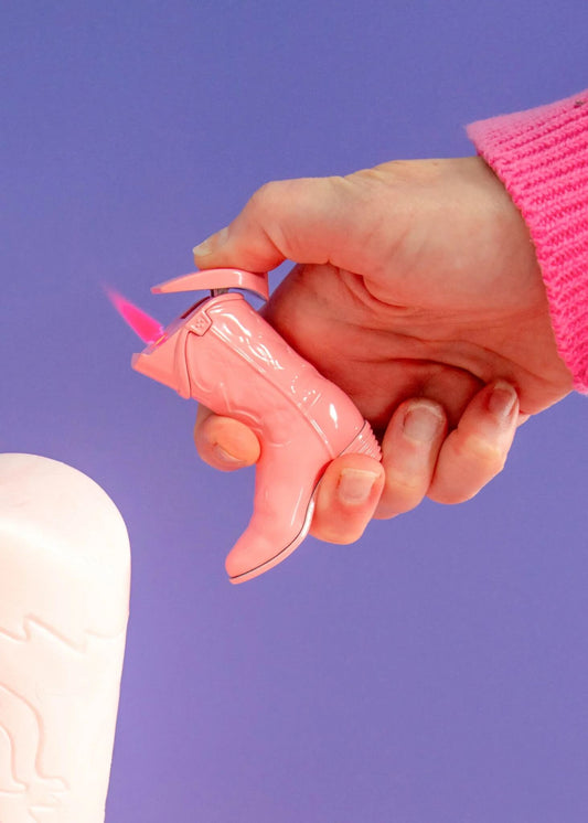 Cowboy boot lighter

Pink flame refillable lighter

Windproof butane lighter

Canna Style cowboy lighter

Metal western-themed lighter

Novelty cowboy lighter