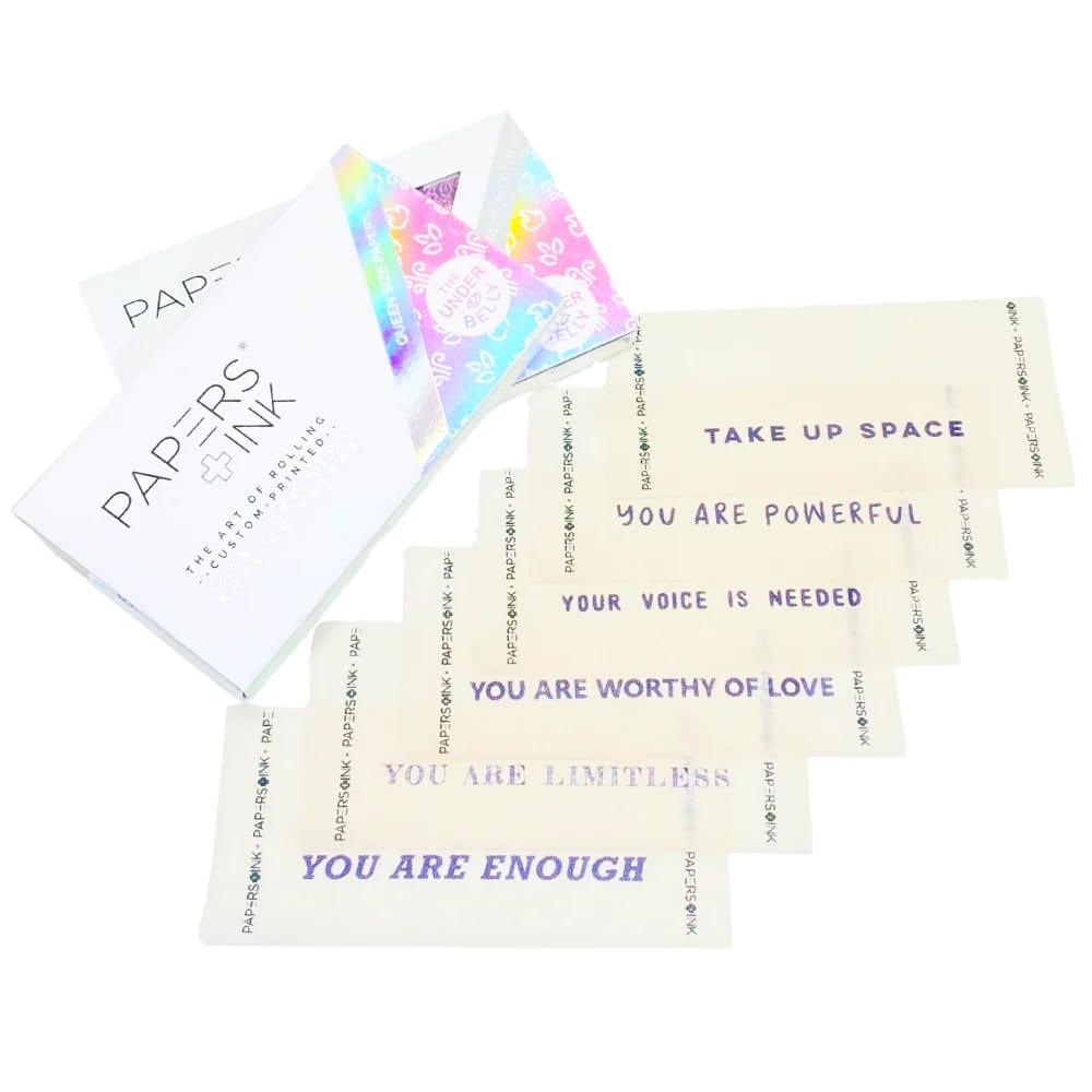 Motivational cards with affirmations and a stationery item on a white background
