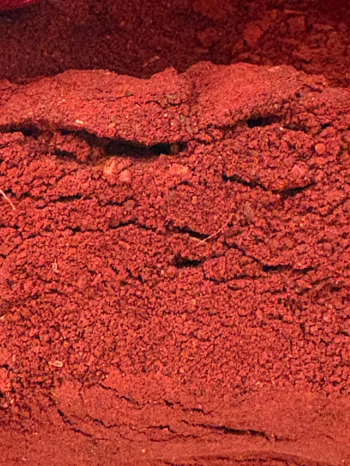 Close-up of Dragon’s Blood resin powder showing fine texture and color variations.