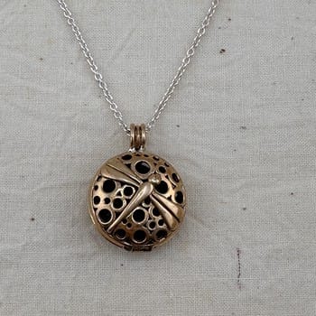 dragonfly necklace, diffuser jewelry, essential oil necklace, Jewelry Evolution, lava rock diffuser, aromatherapy necklace, renewal symbol, dragonfly pendant, mindfulness jewelry, YENology accessories