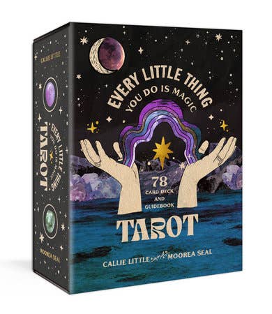 Tarot card set packaging with hands holding a colorful card against a starry night sky.