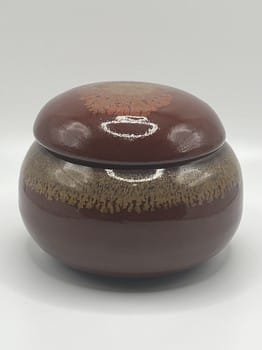 Golden red flower container
Mike Teal pottery
Hand-thrown ceramic jar
Small lidded stoneware box
Floral textured pottery