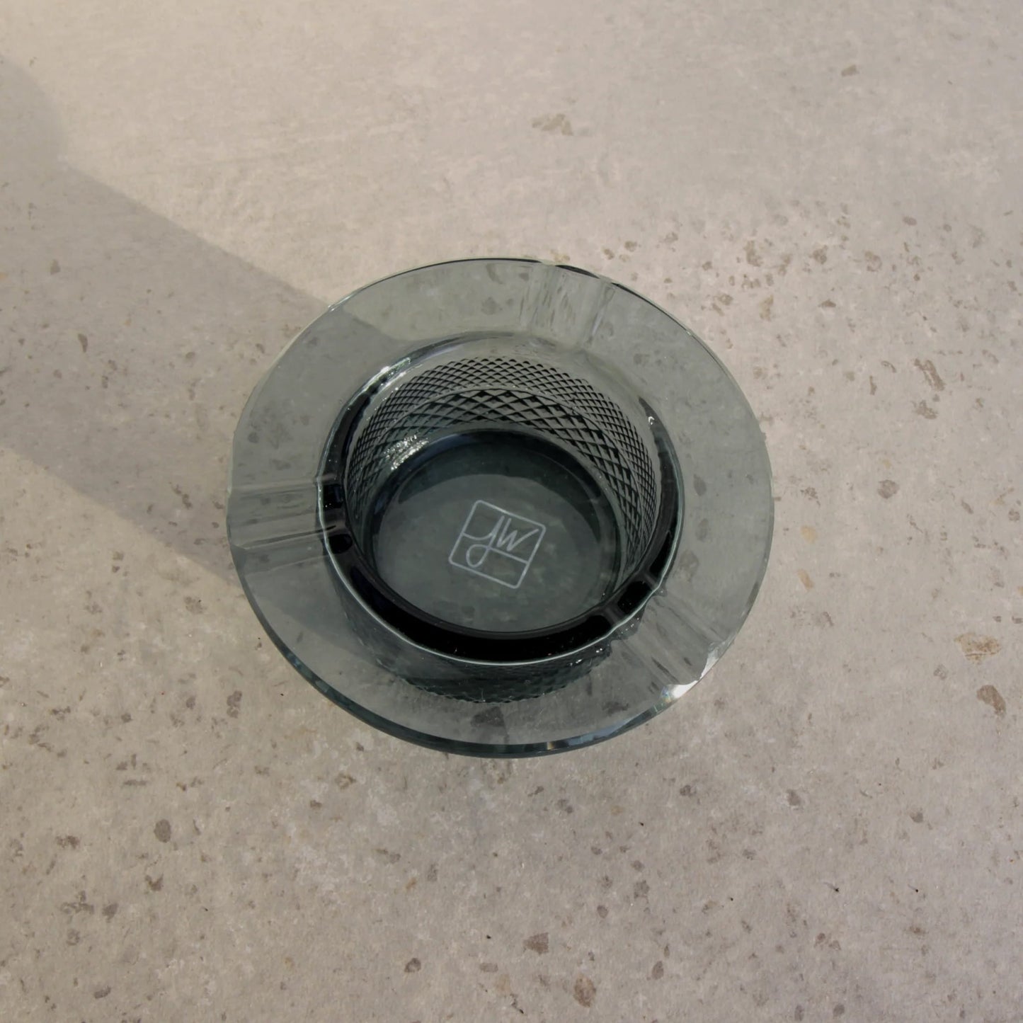 Smoke colored ash tray
Modern classic ashtray design
Heavy glass ashtray with notches
Jane West smoking collection