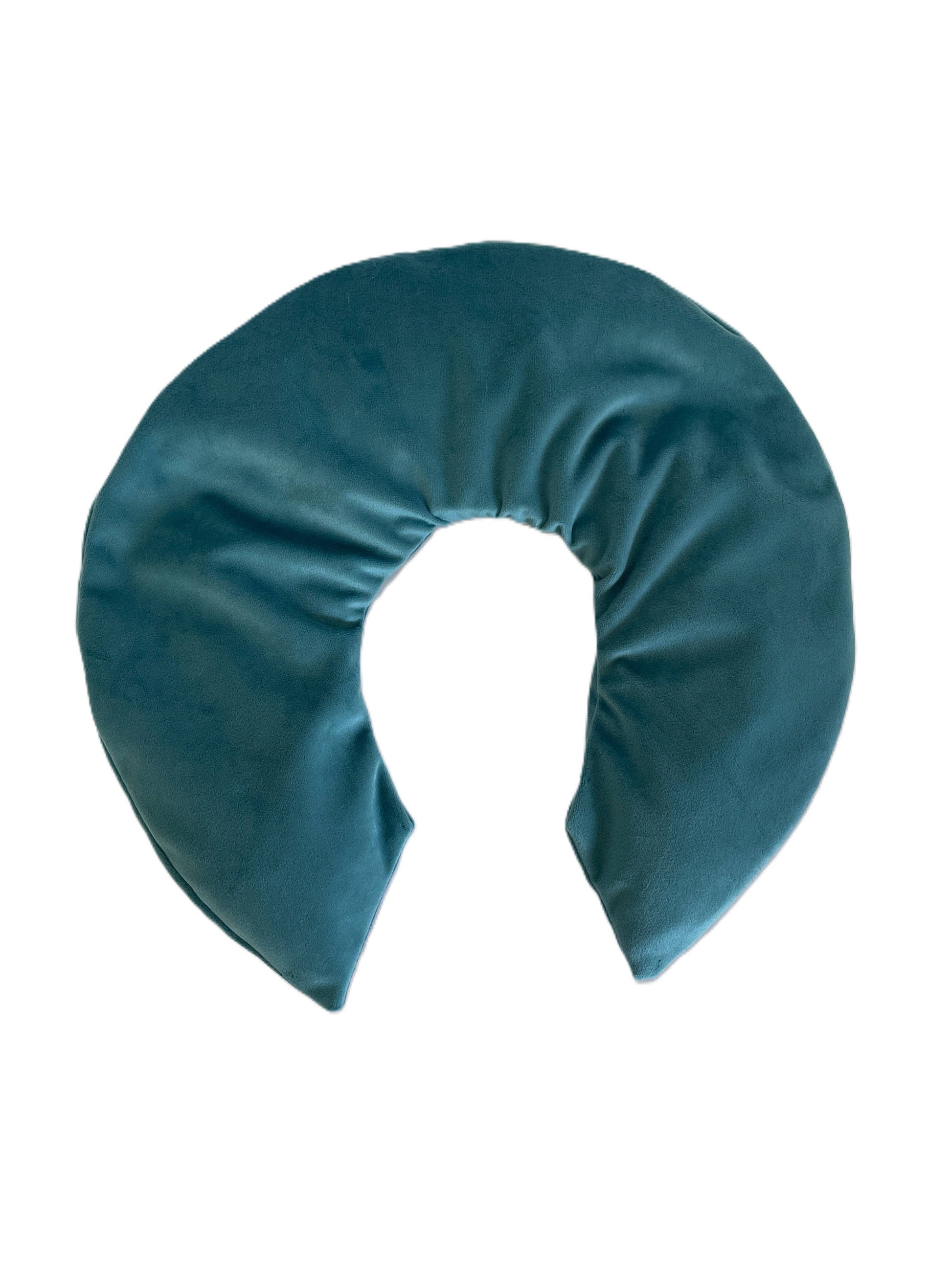 Teal neck pillow on a white background