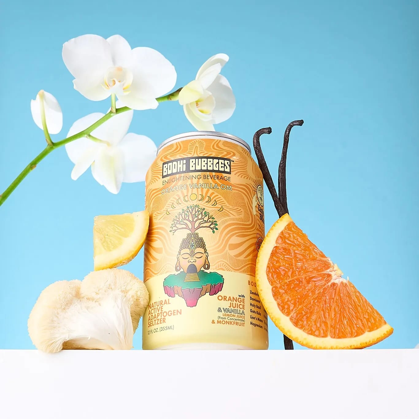 Can of Bodhi Bubbles drink with orange slices, vanilla bean, and white flowers