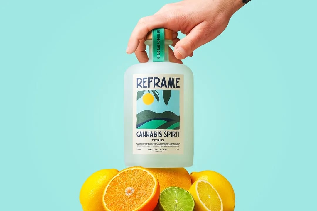 Bottle of 'Reframe' cannabis spirit with lemons and oranges THC drink