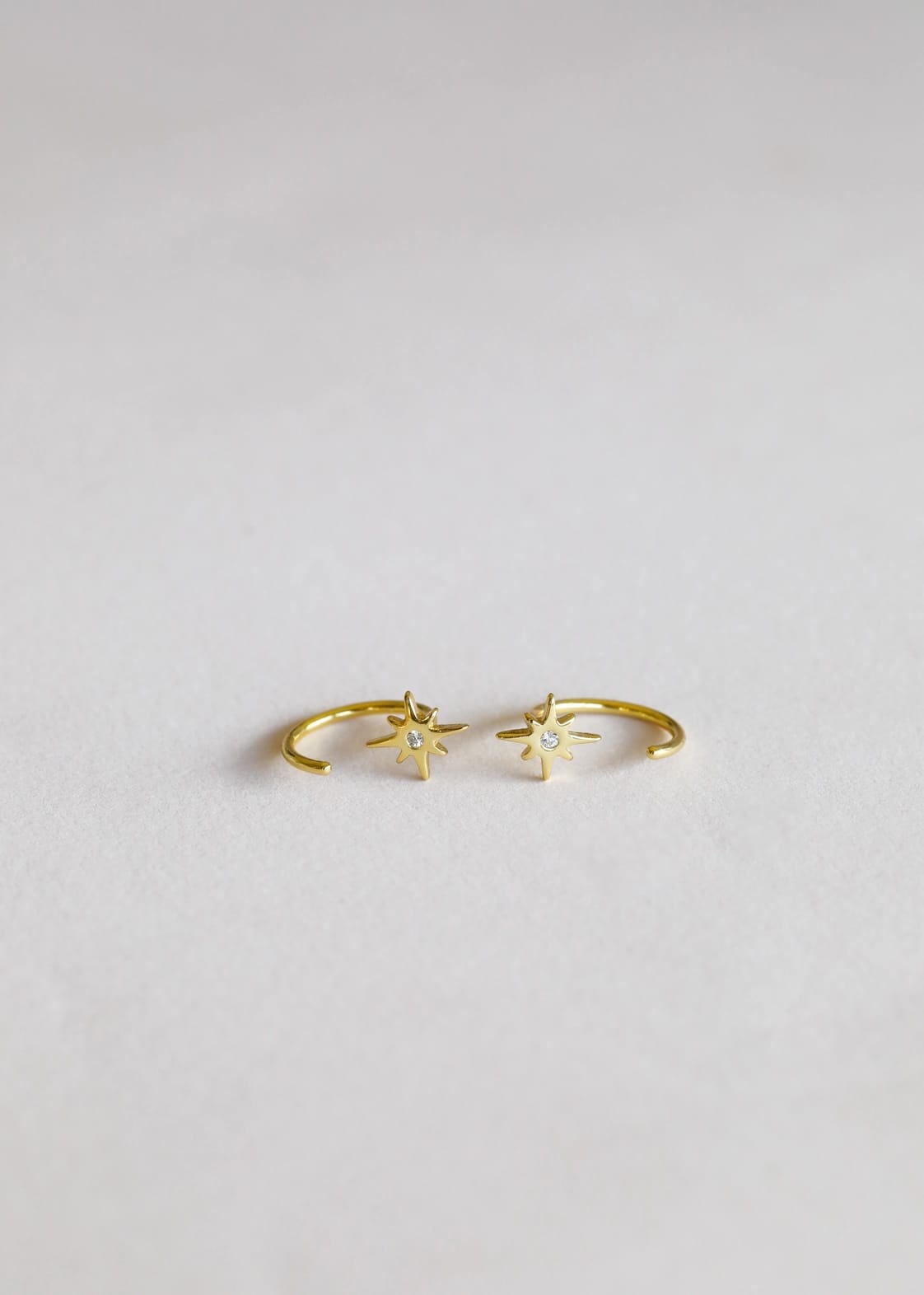 gold star huggies, star huggie earrings, gold huggie hoops, hypoallergenic gold earrings, 18k gold plated huggies, celestial earrings