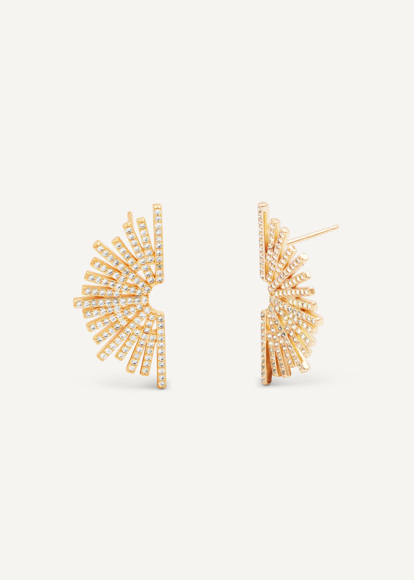 Gold earrings with fan-like design on a white background