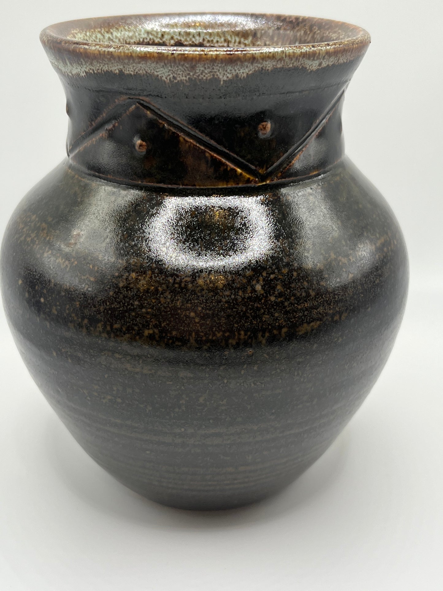 Hand-thrown black stoneware vase by artist Mike Teal. Elegant, functional, and richly detailed—crafted with care and tradition.