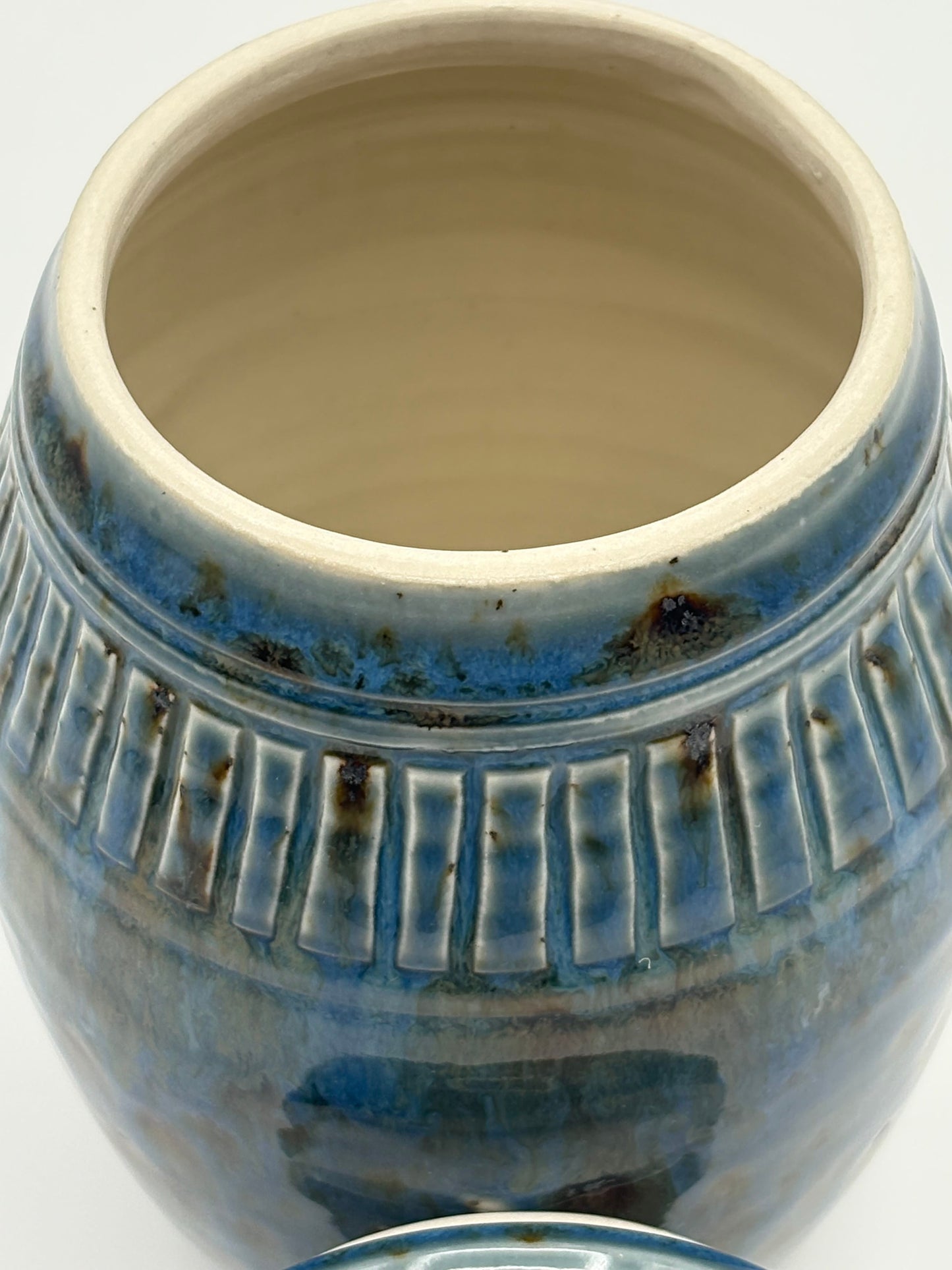 Blue ceramic jar with textured design