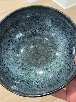 Close-up of a ceramic bowl with a textured surface