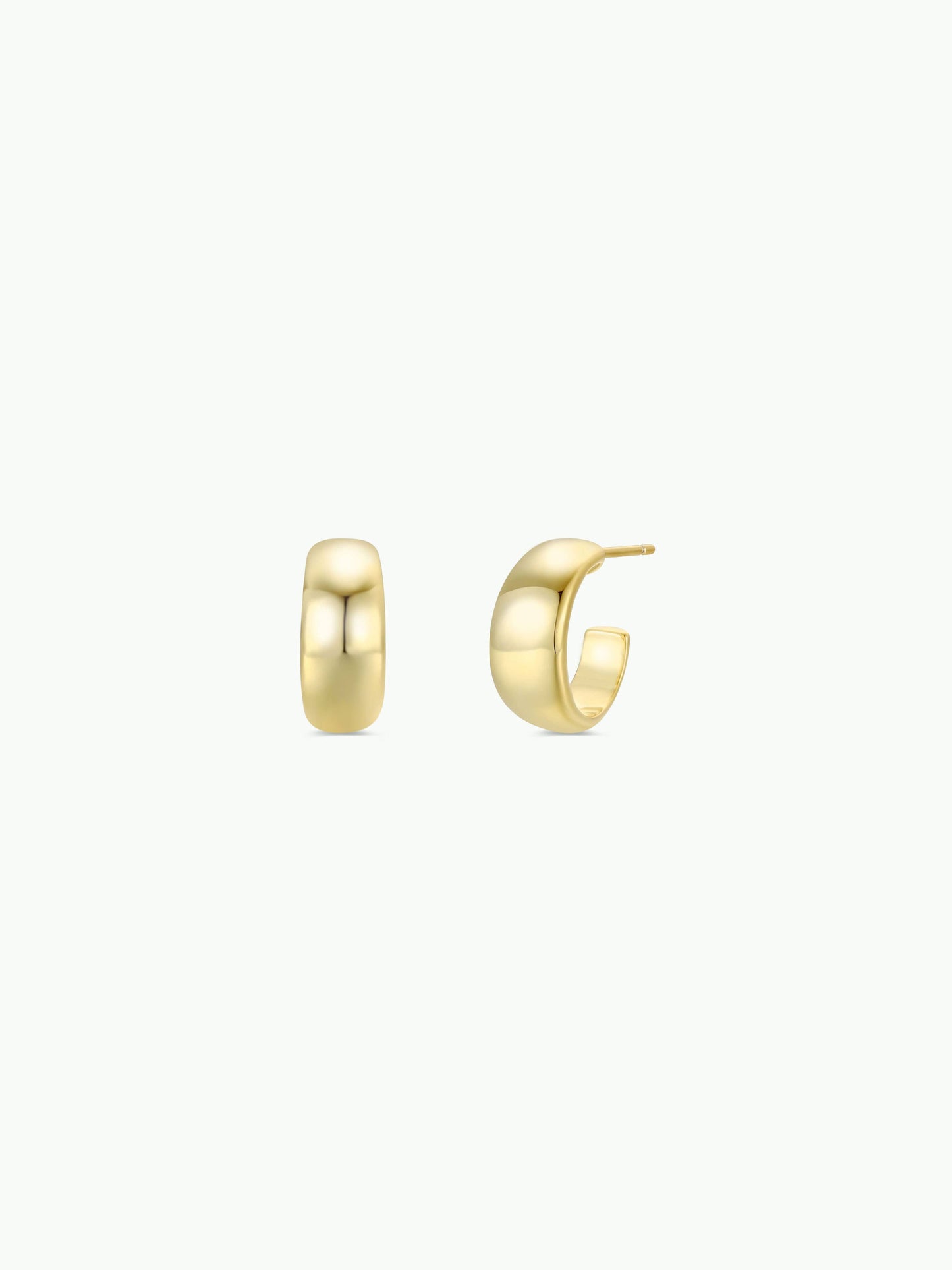 Gold hoop earrings on a white background