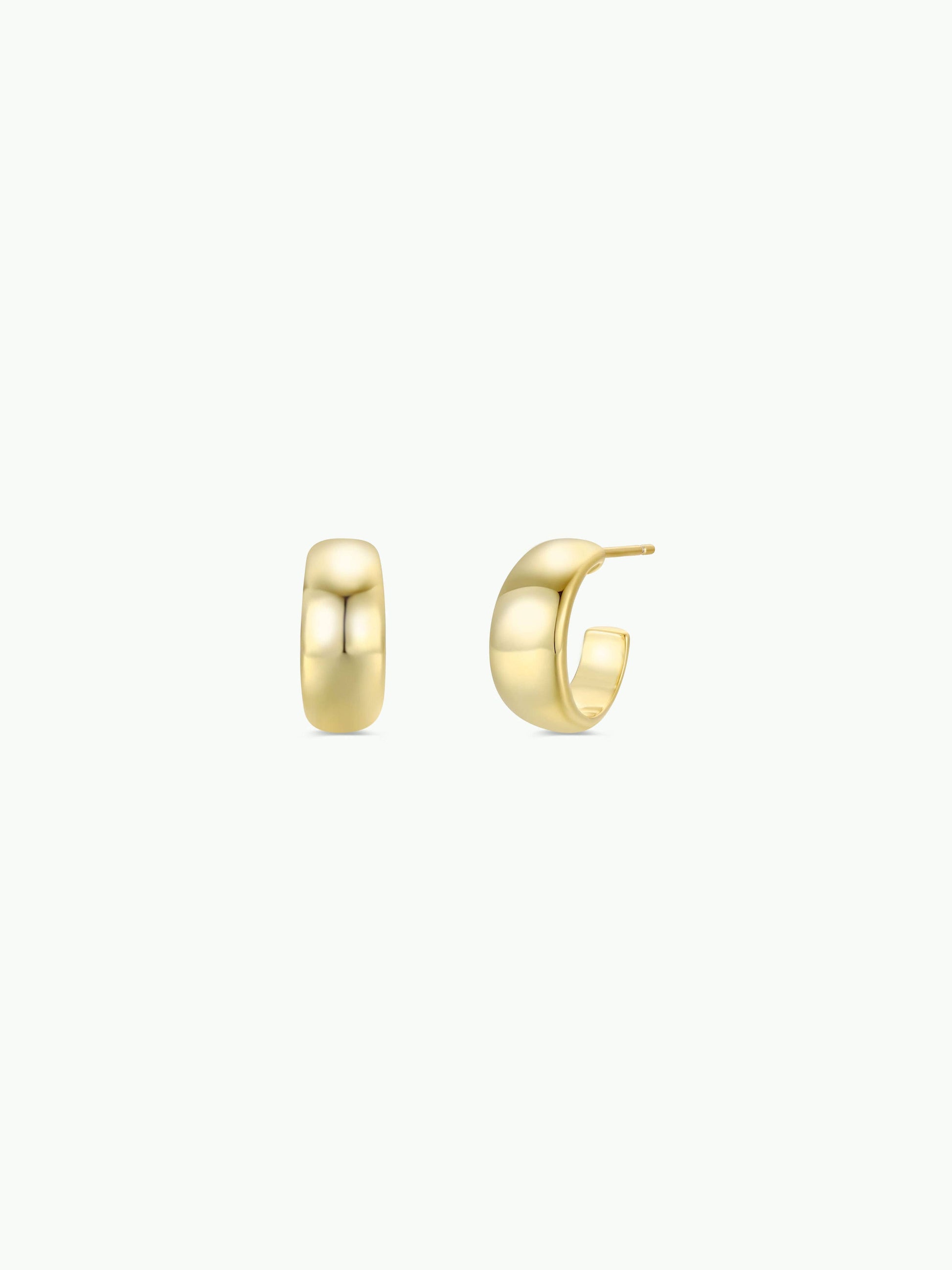 Gold hoop earrings on a white background