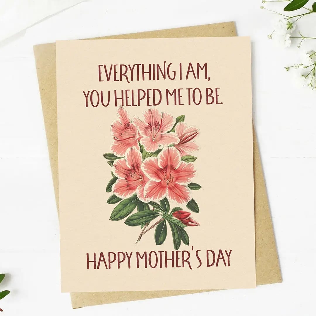 Greeting card with pink flowers and Mother's Day message on a white background