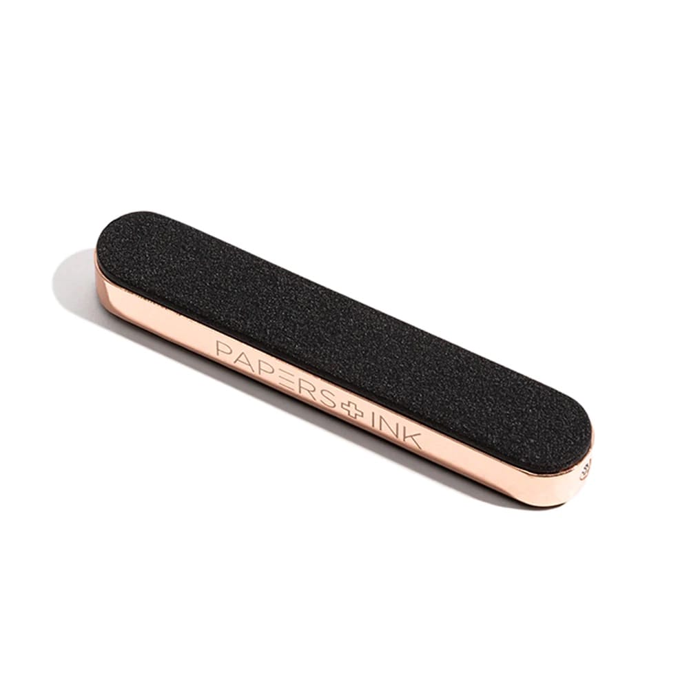 Black and rose gold usb lighter with 'Papers & Ink' branding on a white background
