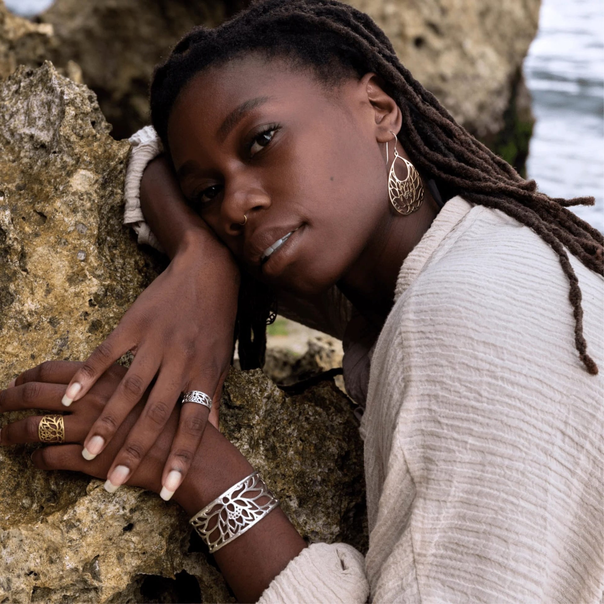 lotus flower meaning, resilience jewelry, peace and harmony, transformation jewelry, yoga jewelry, lotus cuff bracelet, meaningful jewelry, YENology jewelry, spiritual growth jewelry