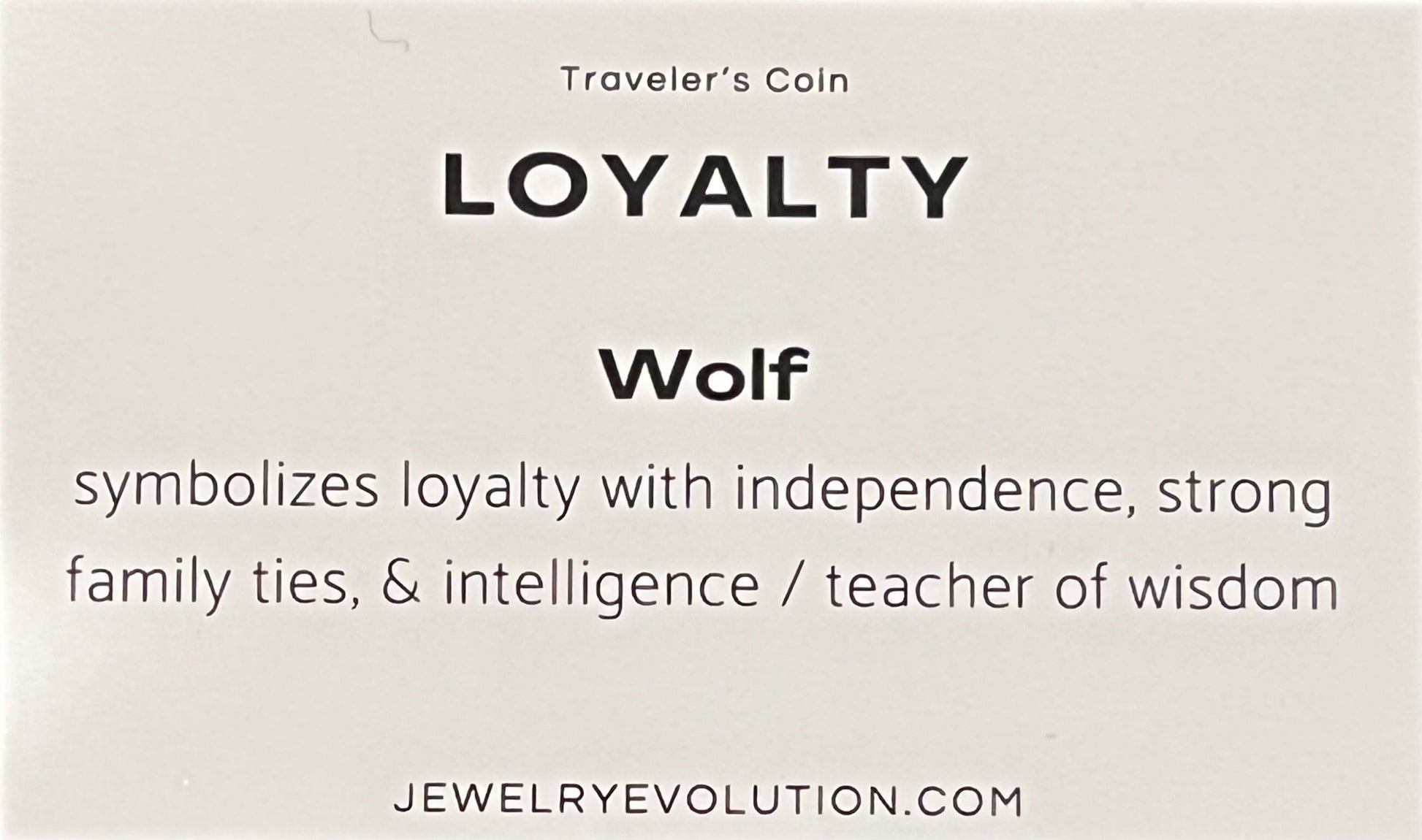 Card with text about a 'Loyalty Wolf' symbol from Traveler's Coin, including description and source link.