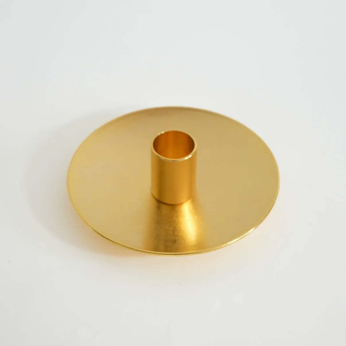 Golden Palo Santo holder with clean, modern design on a neutral background.