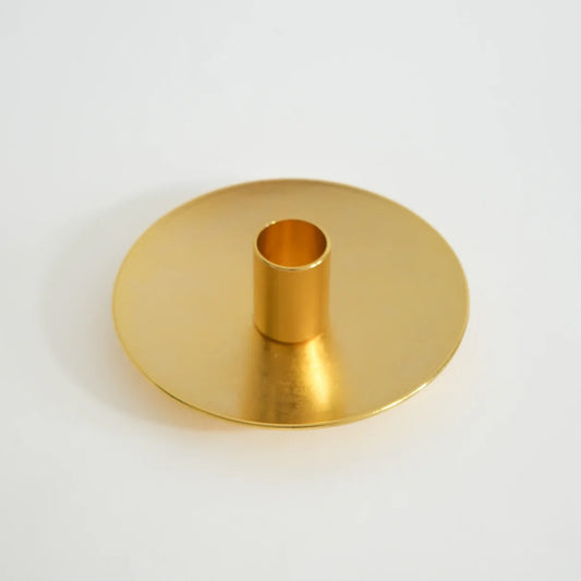 Golden Palo Santo holder with clean, modern design on a neutral background.