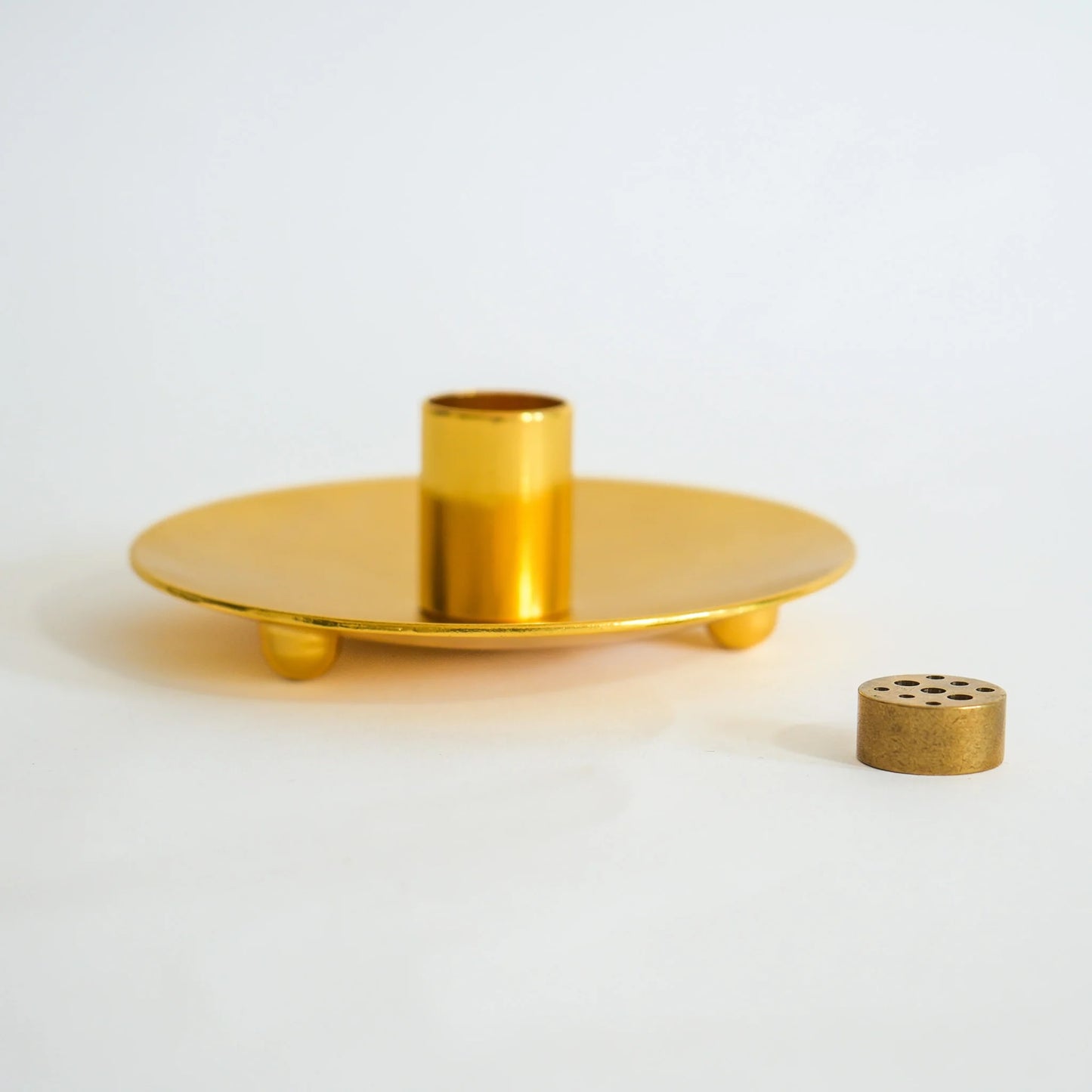 Close-up of metallic Palo Santo ash catcher showing textured finish.