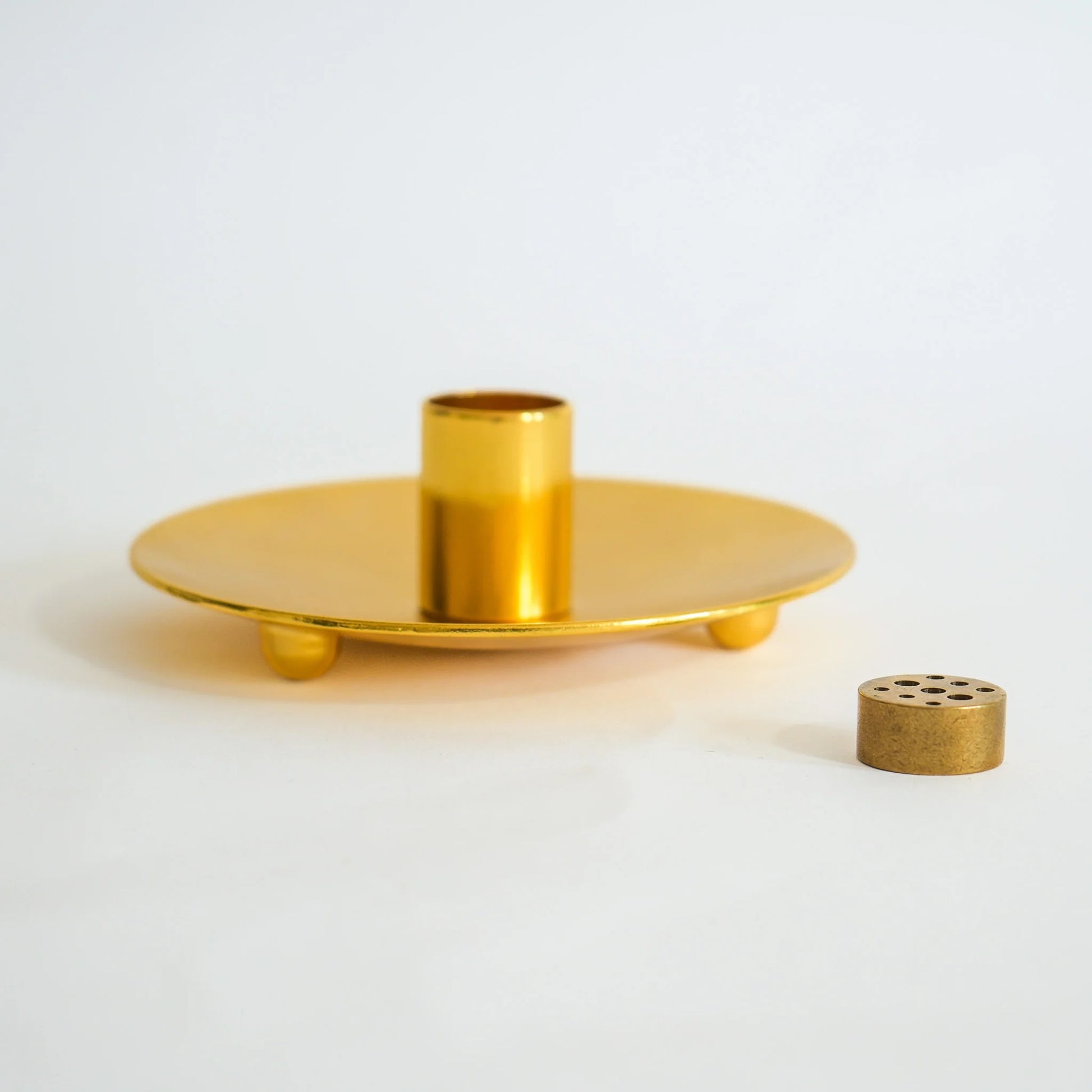 Close-up of metallic Palo Santo ash catcher showing textured finish.