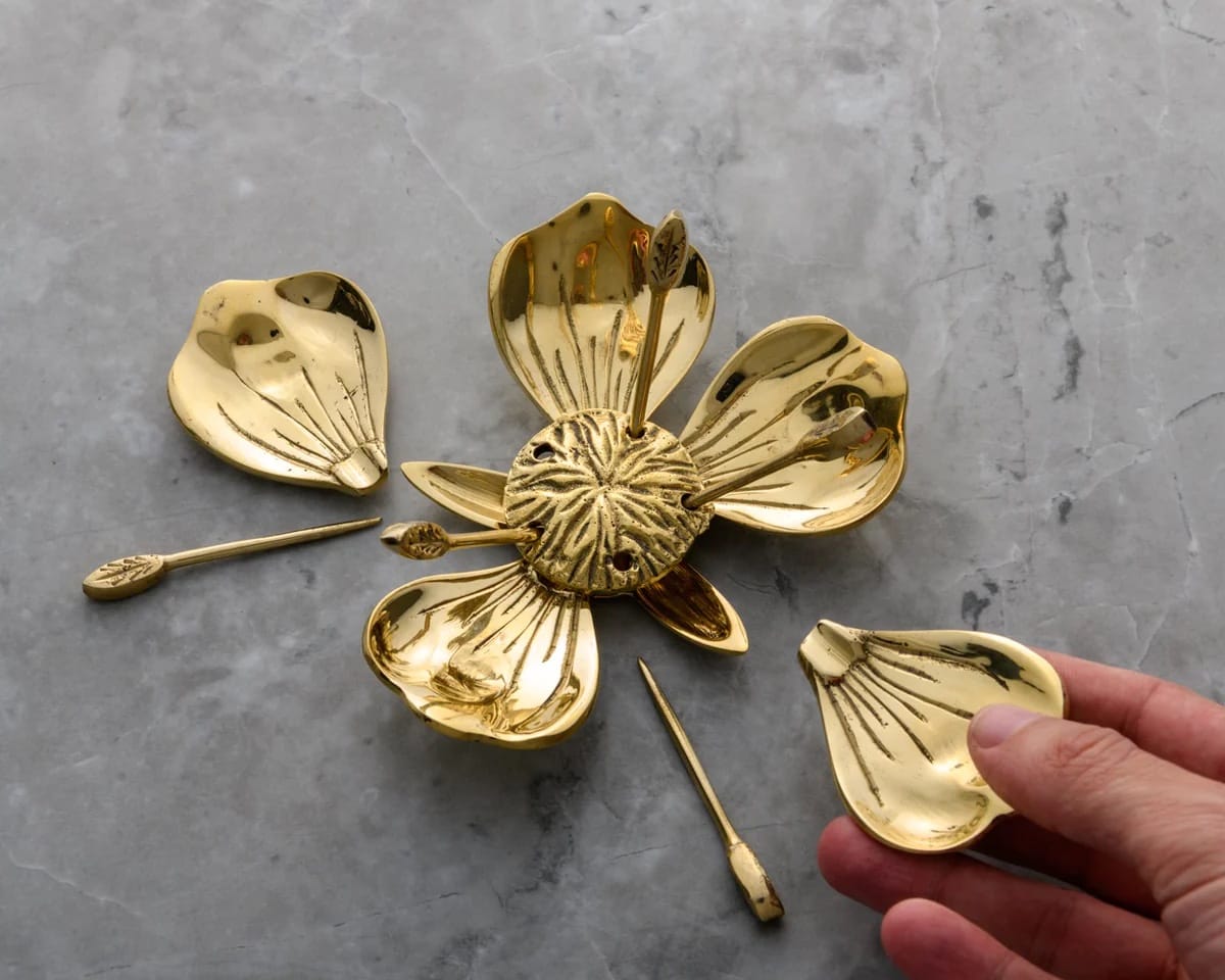 Removable petal ashtrays
Brass poker tools included
Luxury cannabis decor