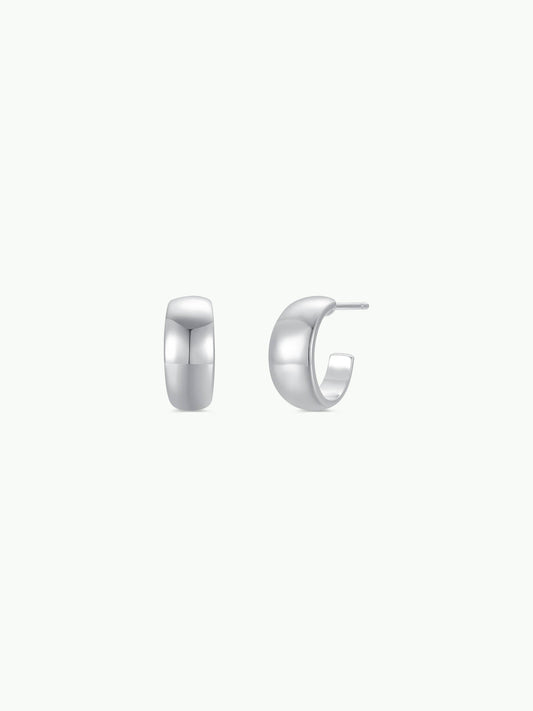 Pair of silver hoop earrings on a white background