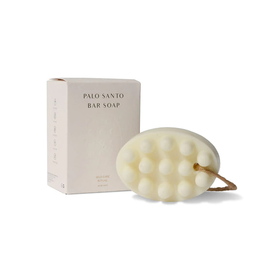 Palo Santo bar soap with packaging on a white background