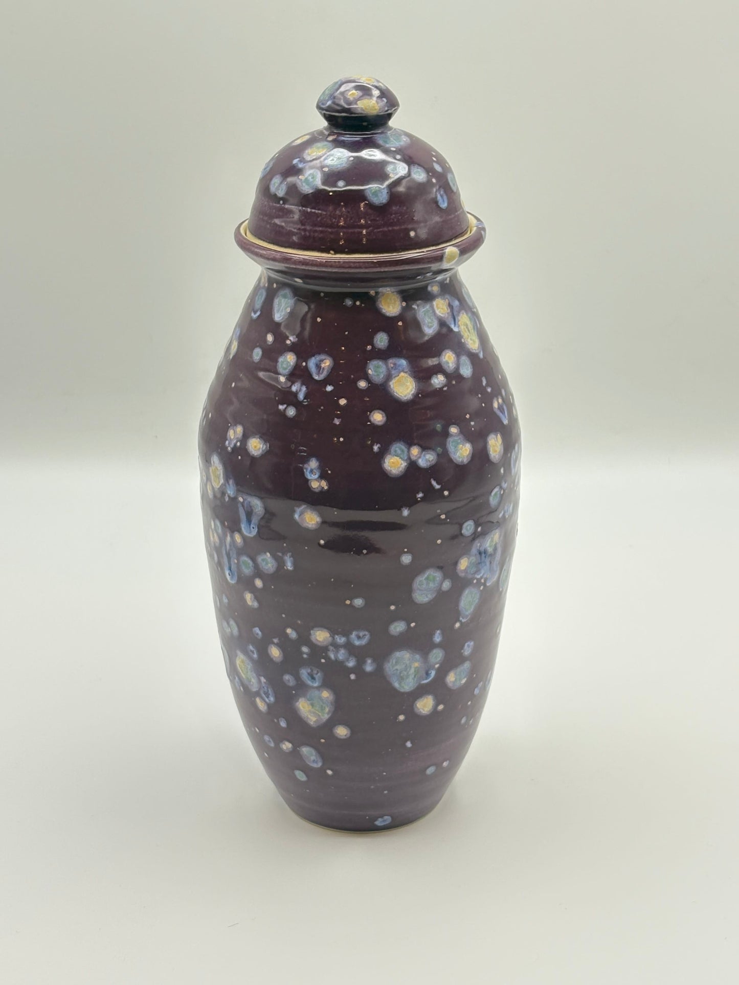 Ceramic jar with a speckled design