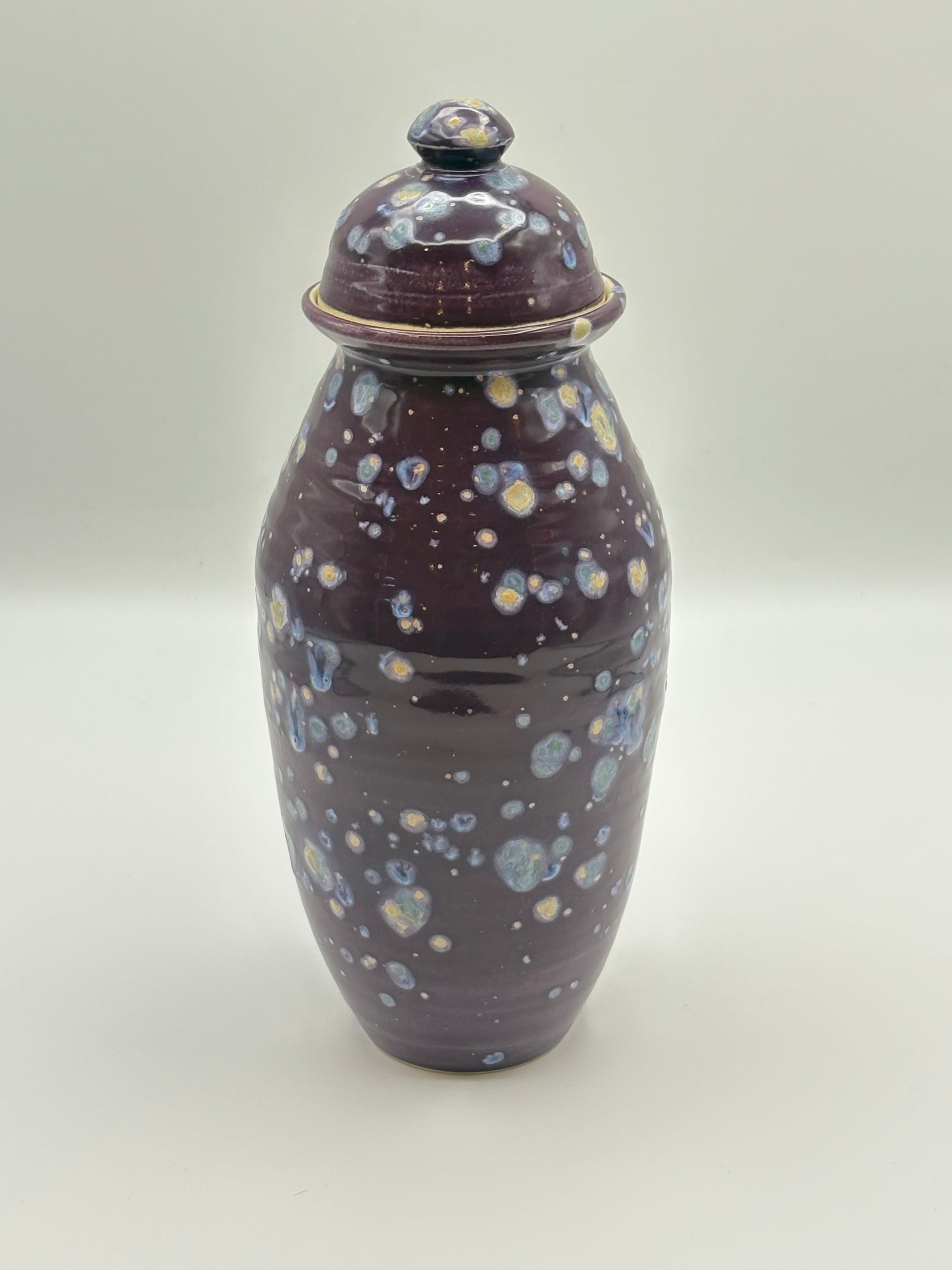 Ceramic jar with a speckled design