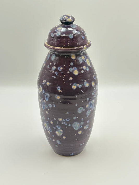 Ceramic jar with a speckled design