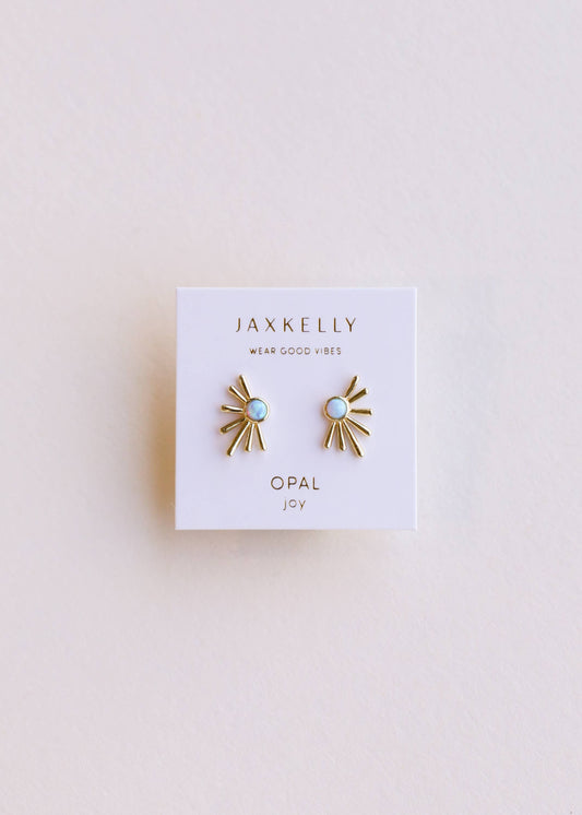 Pair of gold and opal earrings on a Jaxkelly branded card against a light background