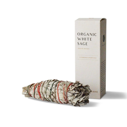 Bundled organic white sage with packaging on a white background